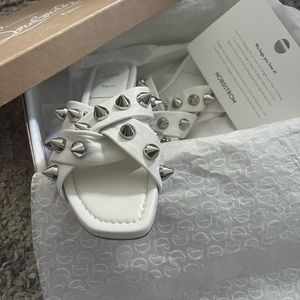 CHRISTIAN LOUBOUTIN MISS SPIKA FLAT LEATHER SANDALS